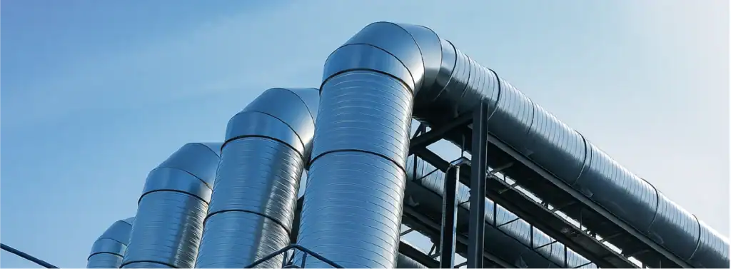 Ductería metálica para ventilación industrial y extracción de aire instalada por MCAT en nave